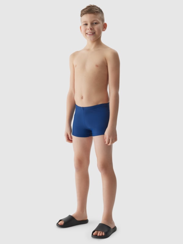 Boy in swimming trunks online