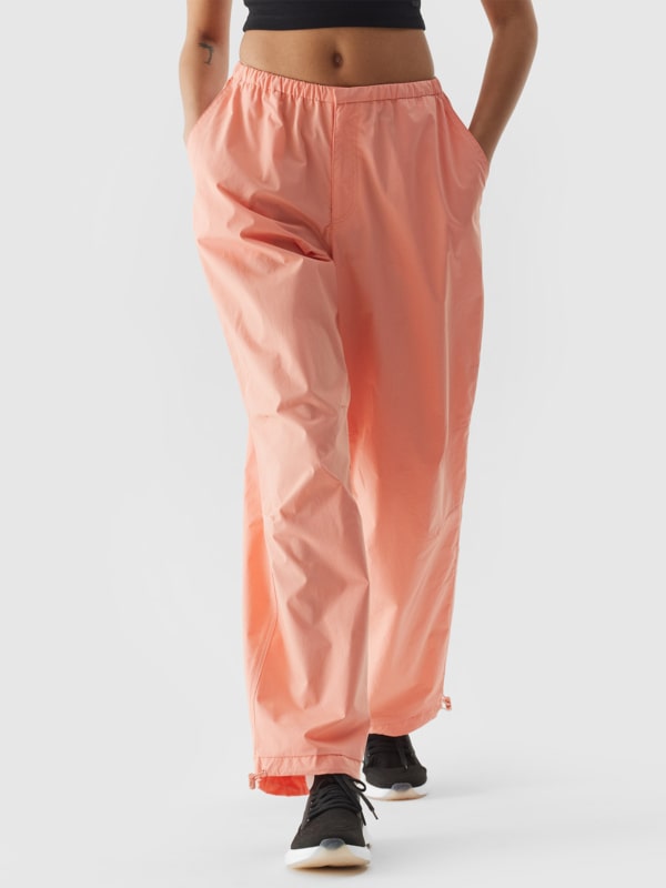 Women s casual baggy parachute trousers salmon 4F Sportswear and shoes